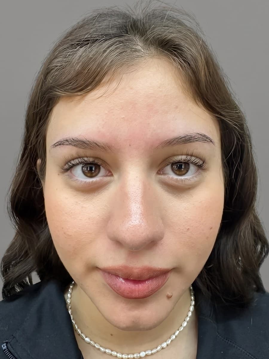 Kayla W. before her brow session at Microblading LA — natural, sparse brows