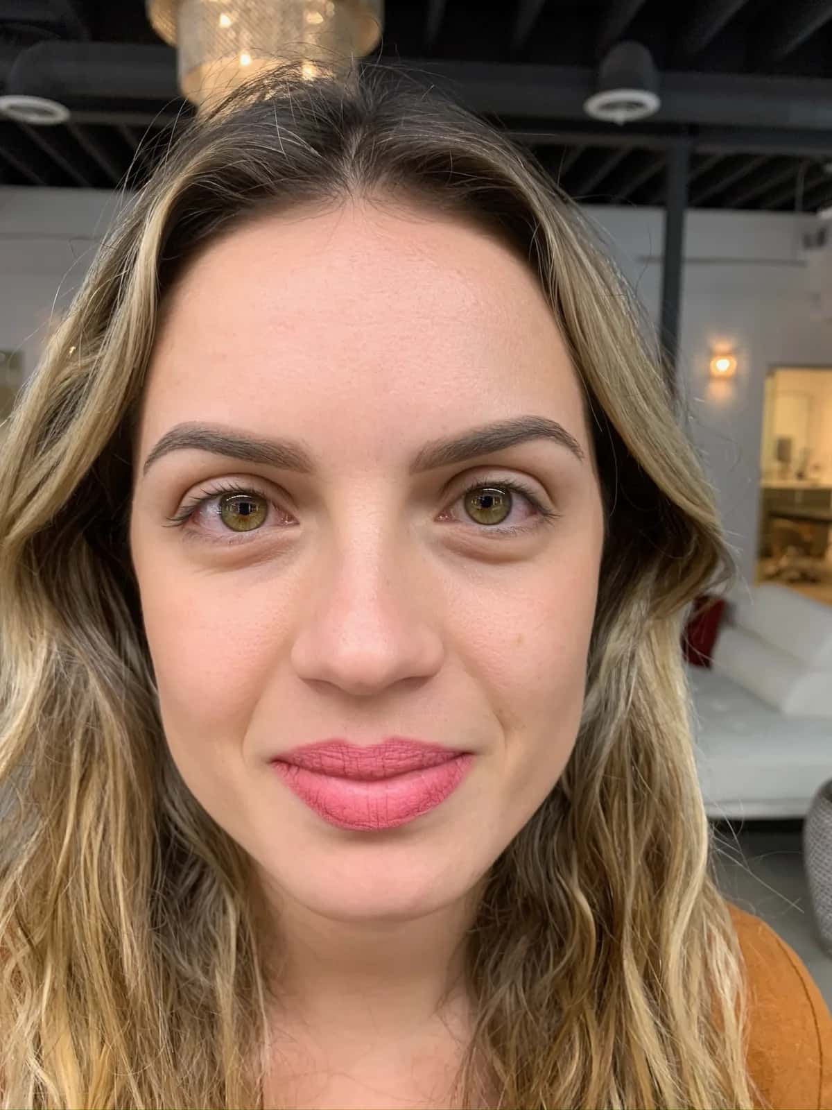 Powder brows at Microblading LA: soft, softly arched dark brown brows with a gradient finish on a woman with blonde wavy hair